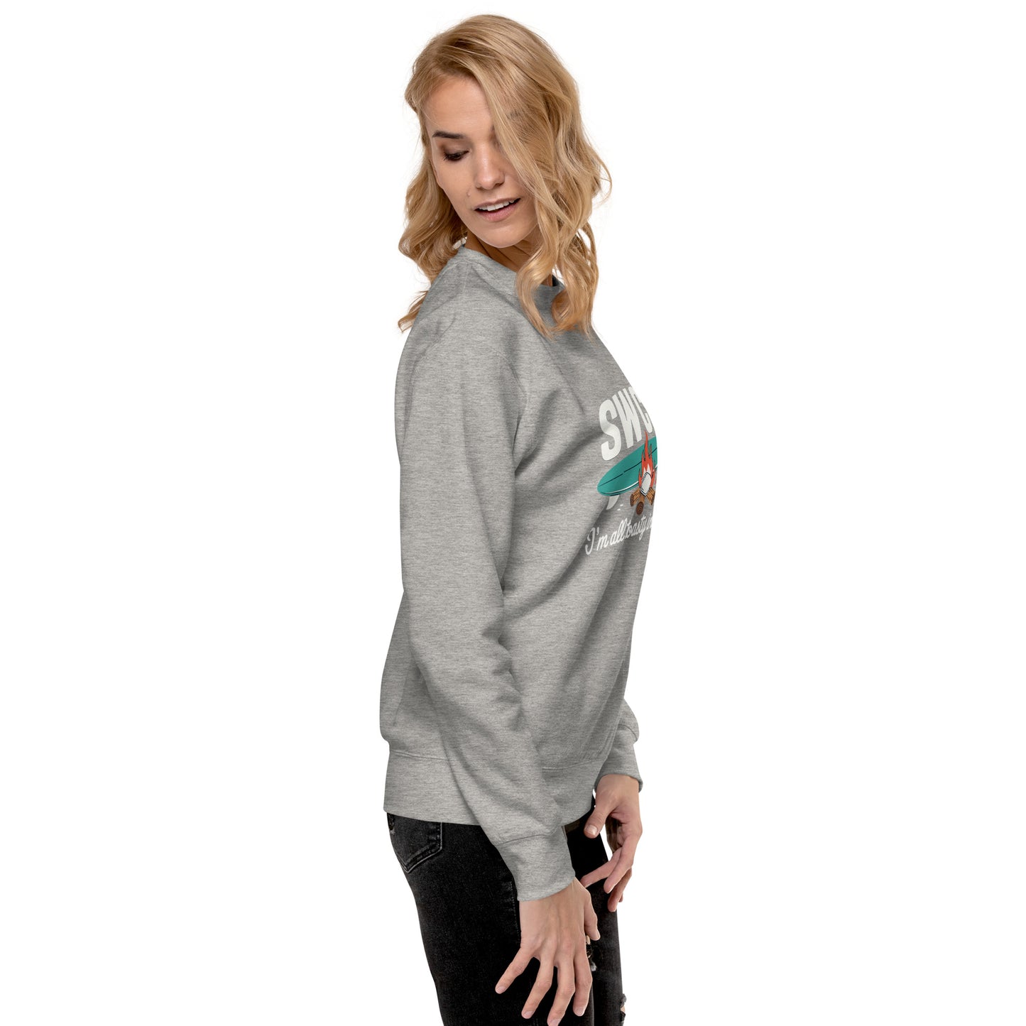 Blonde woman modeling unisex premium grey sweatshirt with colorful graphic and text, paired with black jeans