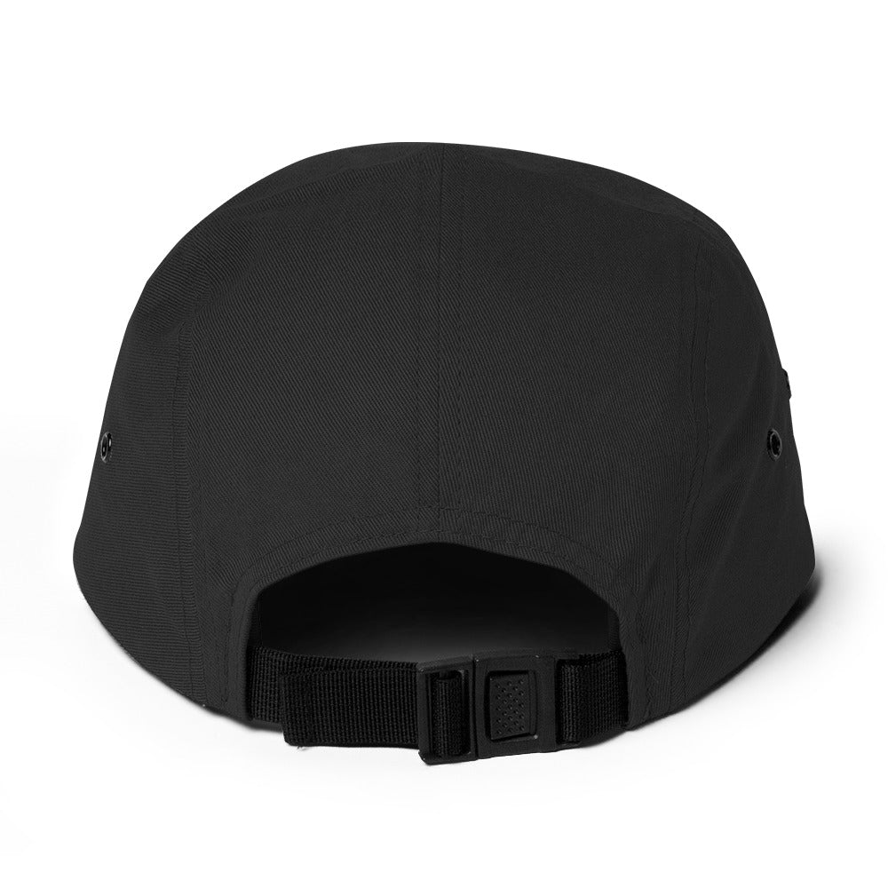 Back view of black 5-panel cap with adjustable strap and metal eyelets on white background