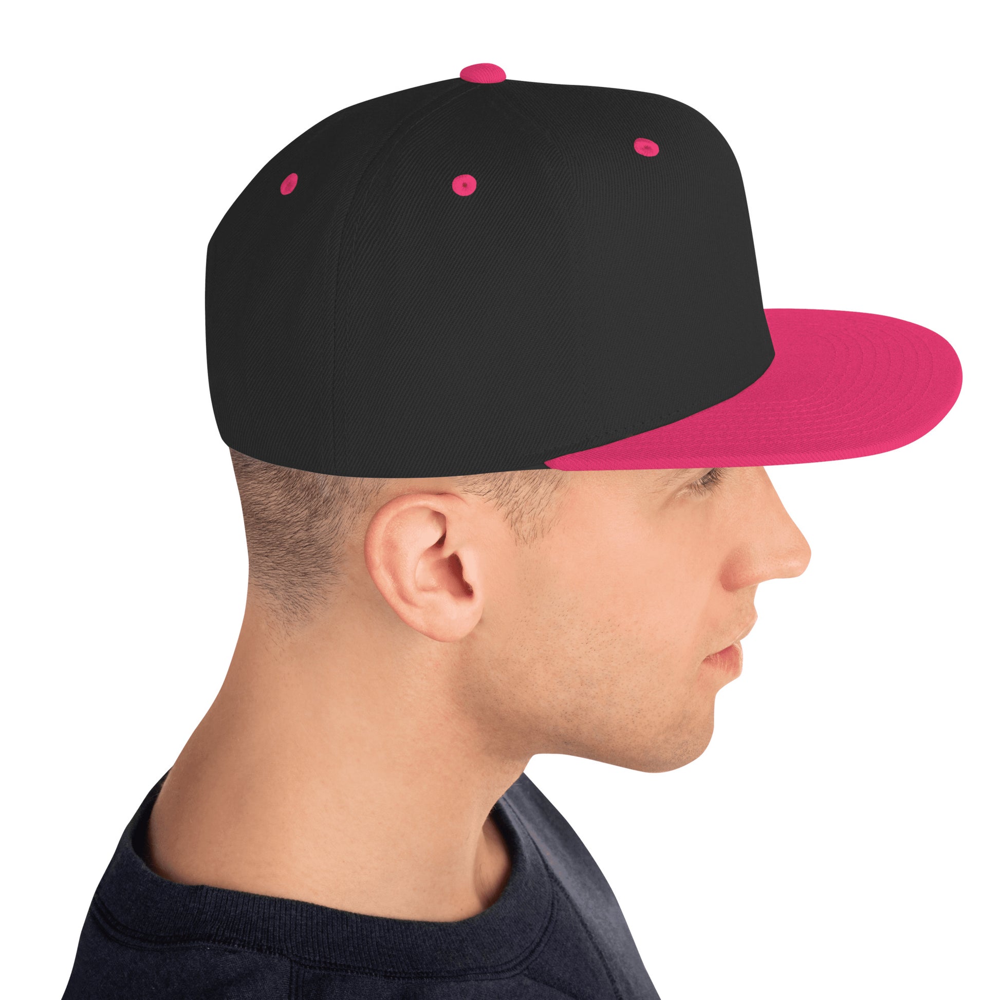 Side view of man wearing black snapback cap with neon pink brim and accents
