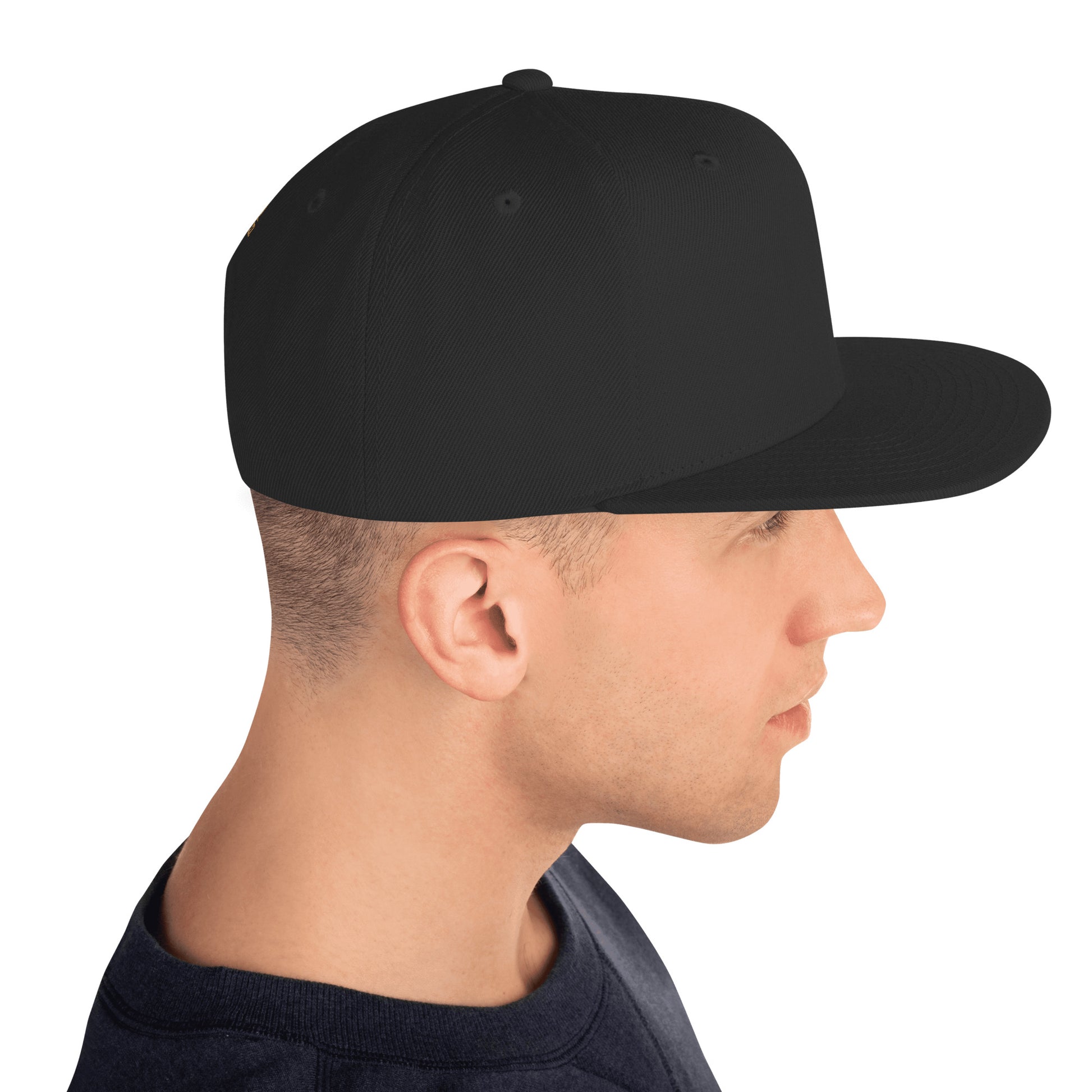 Side view of a man wearing a classic black snapback hat with flat brim