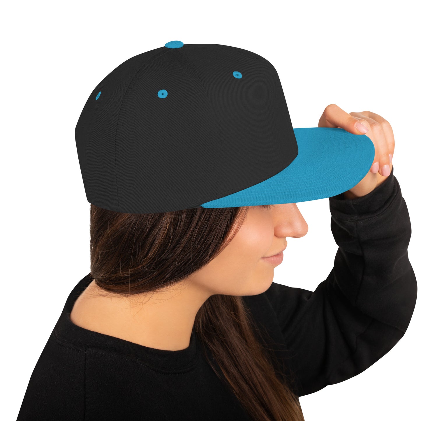 Side view of woman wearing a classic black snapback hat with a teal flat brim and teal eyelets
