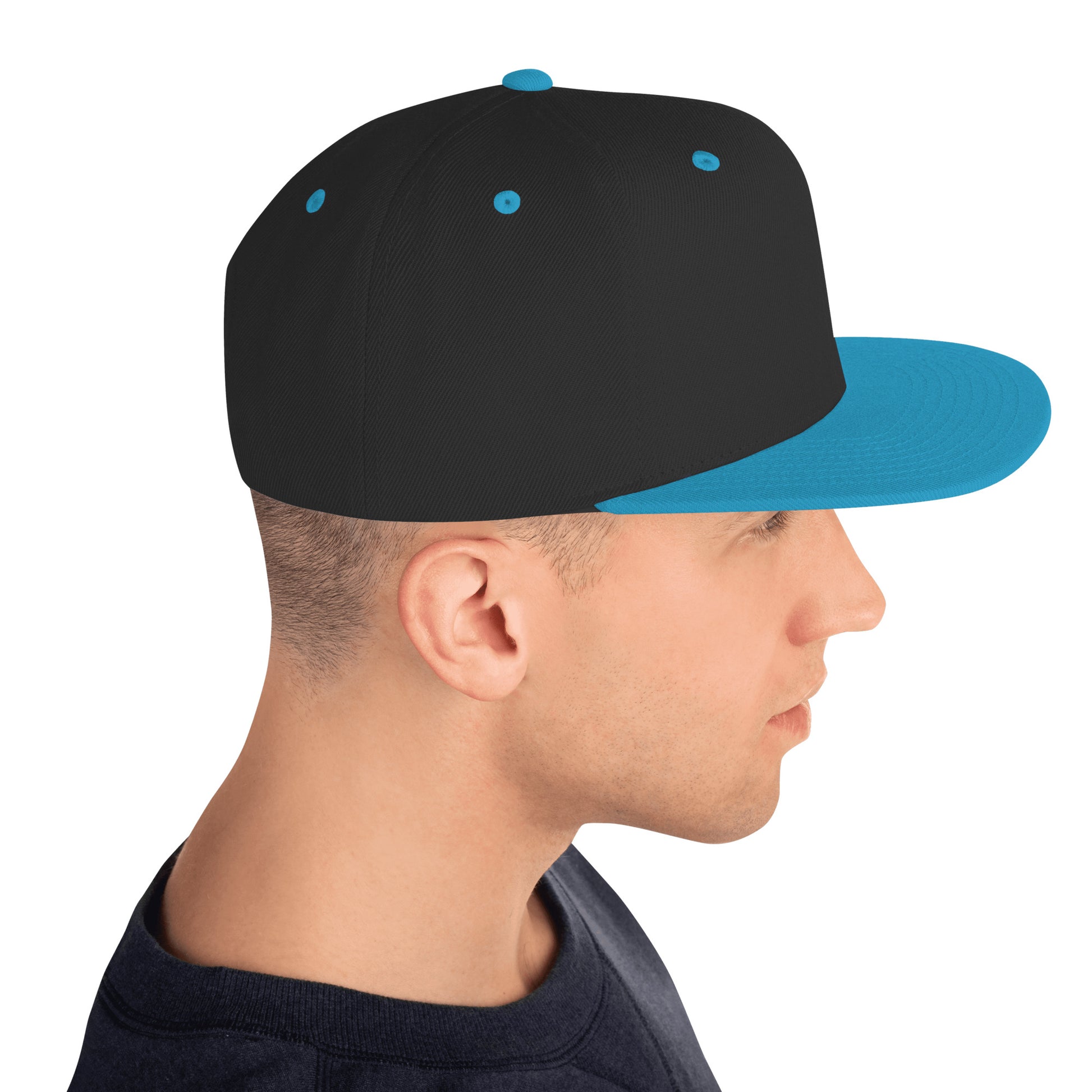 Side view of a man wearing a classic black snapback hat with teal brim and teal eyelets