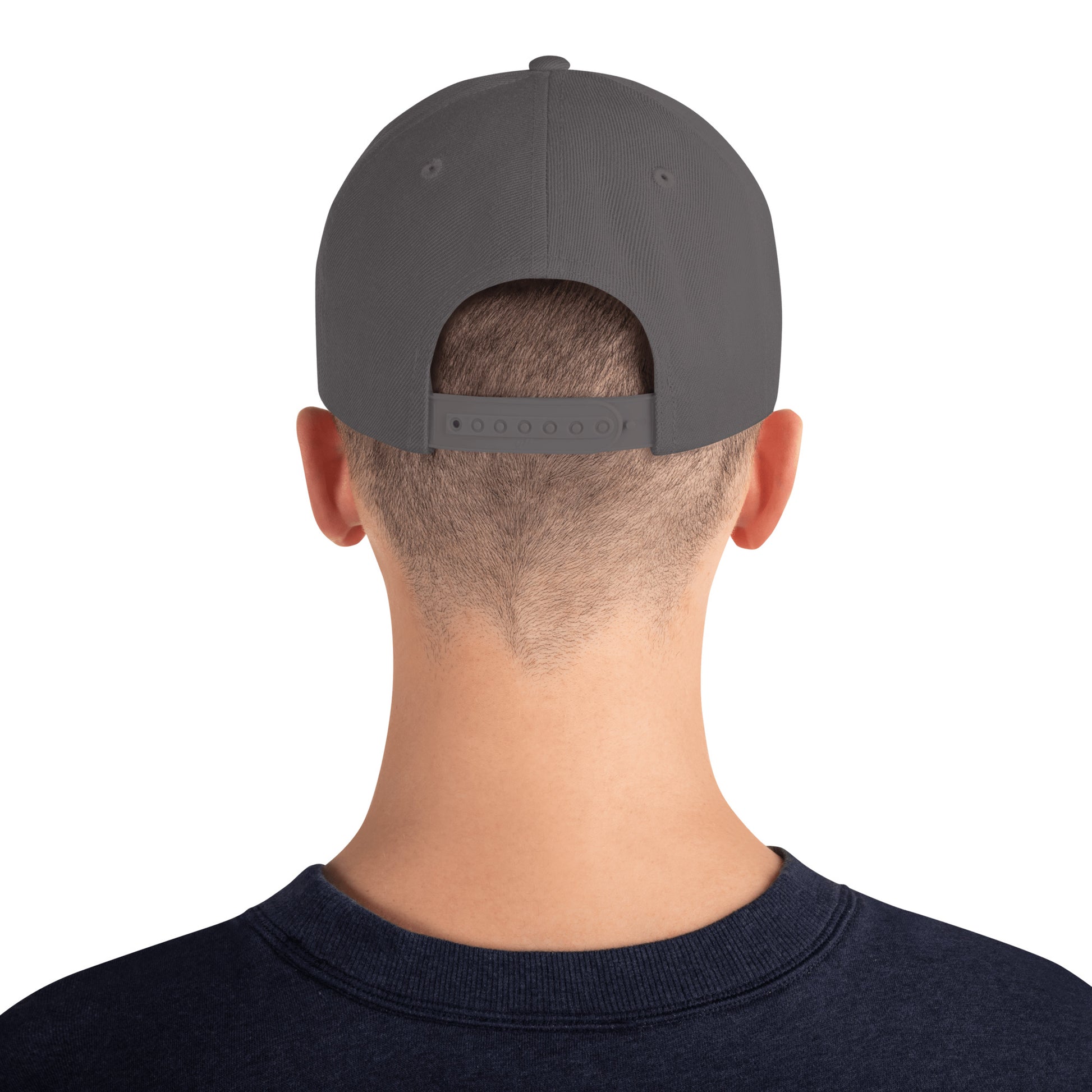 Back view of a person wearing a dark grey classic snapback cap with adjustable strap