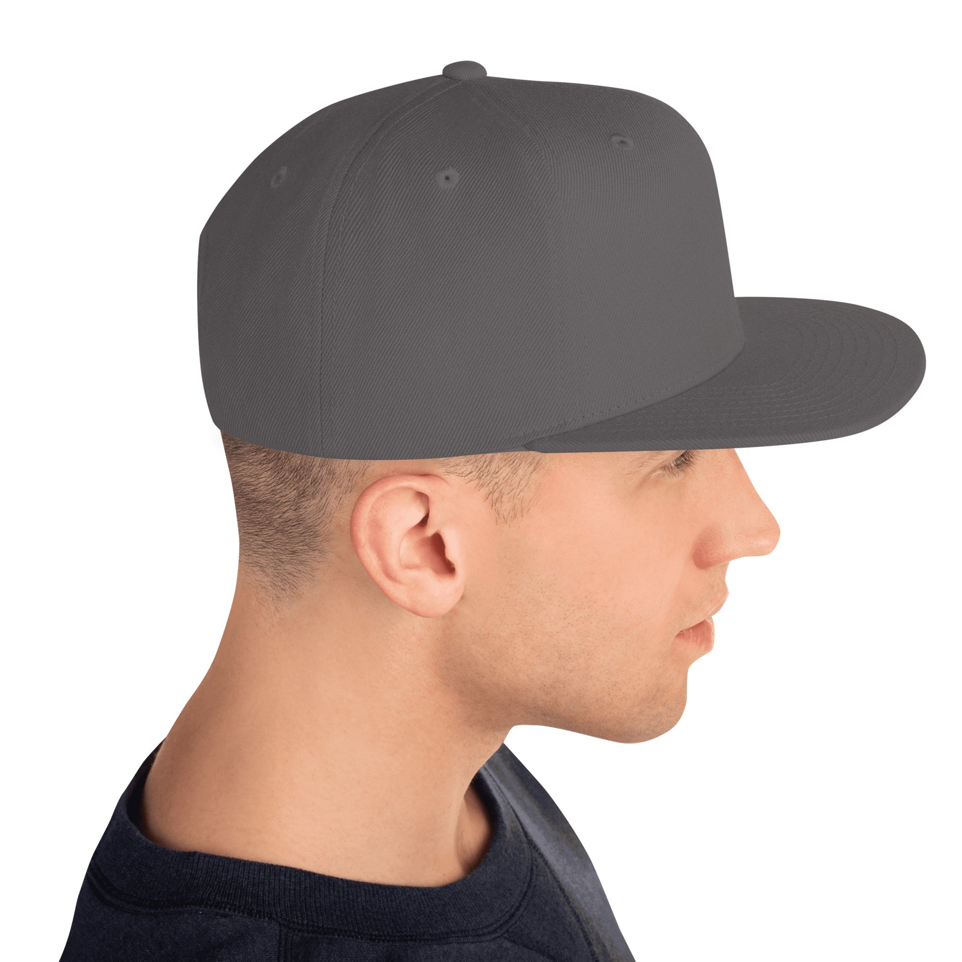 Profile of a man wearing a classic dark grey snapback cap with a flat brim