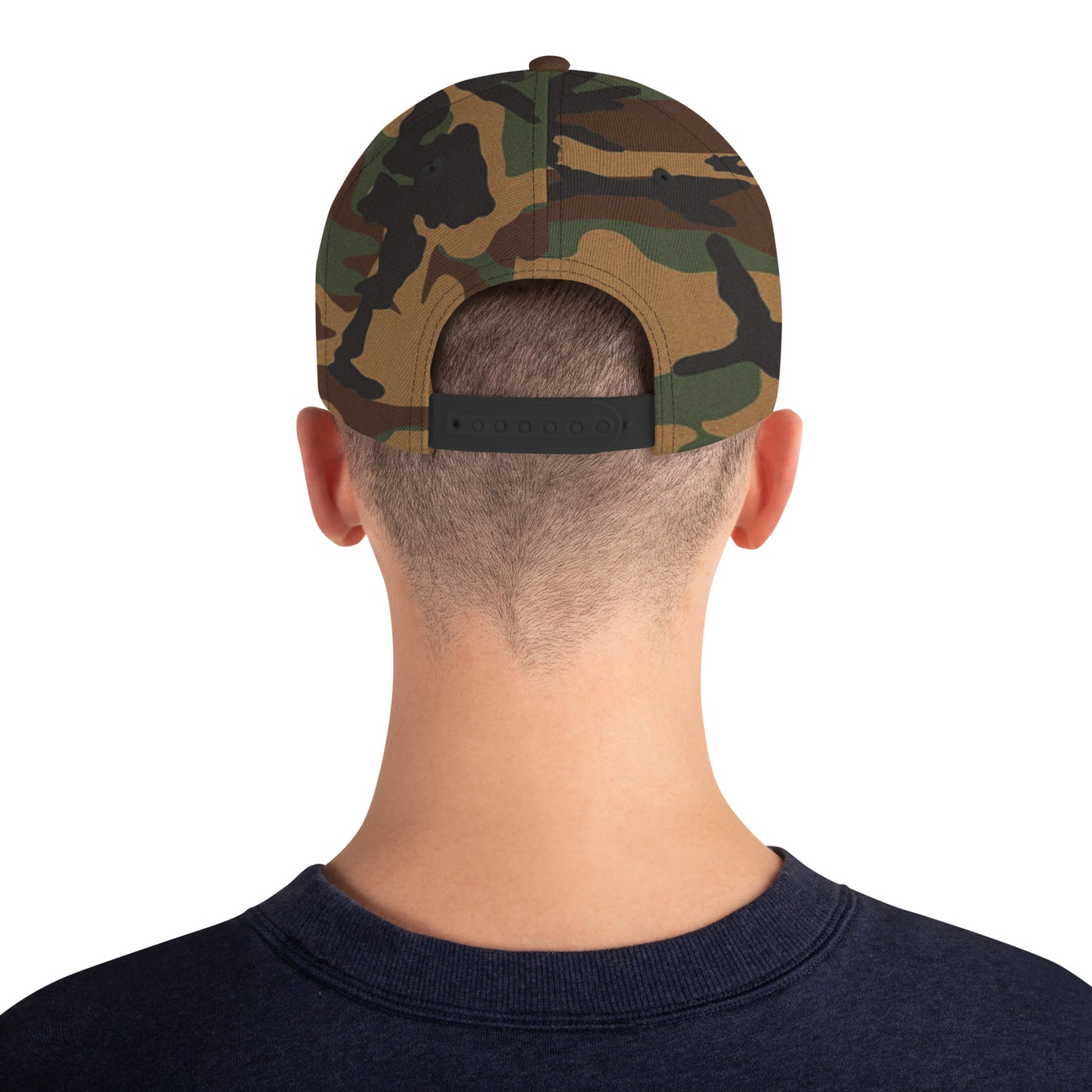 Back view of person wearing adjustable green camo classic snapback cap and navy blue shirt