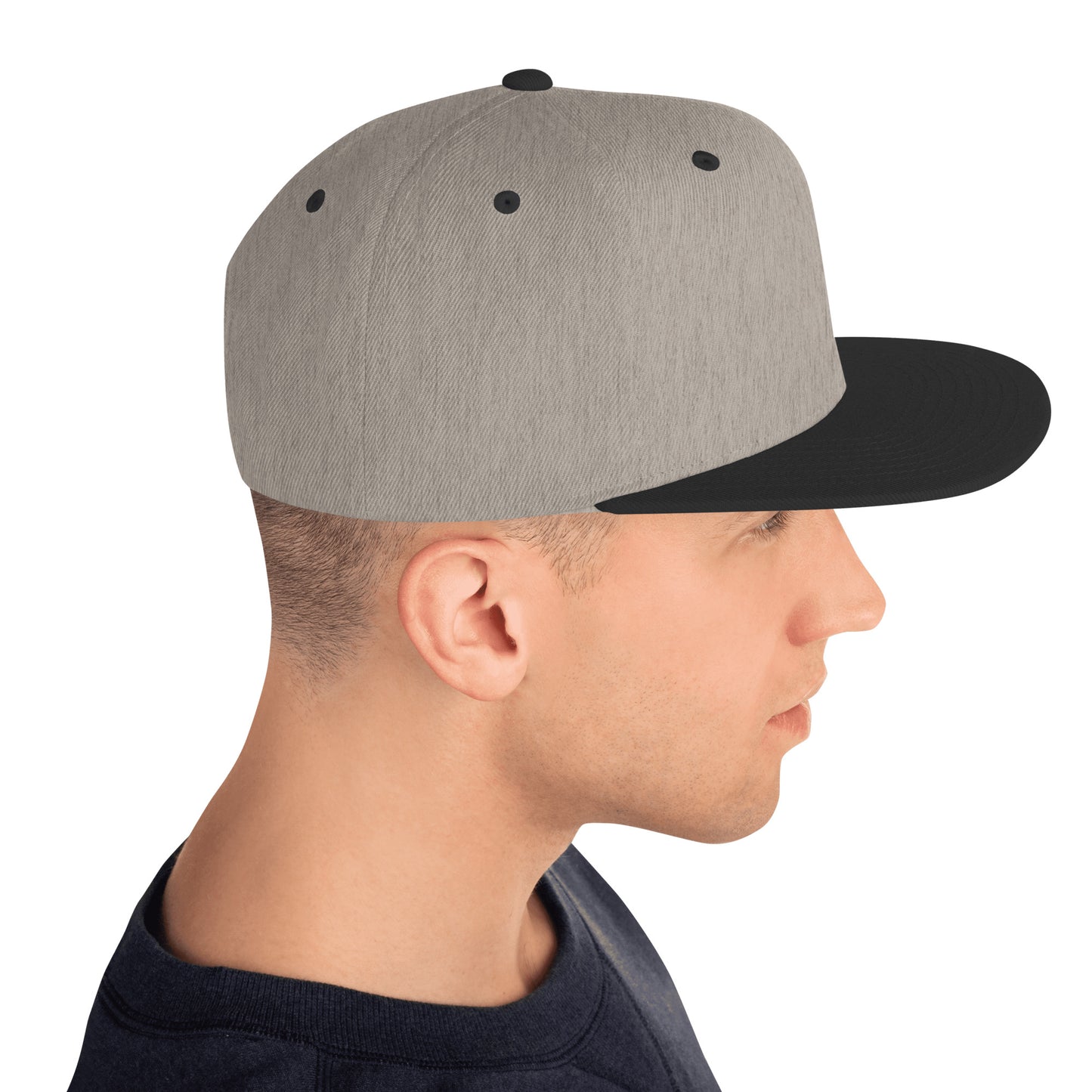 Side view of man wearing classic snapback hat in heather gray with black flat brim and top button