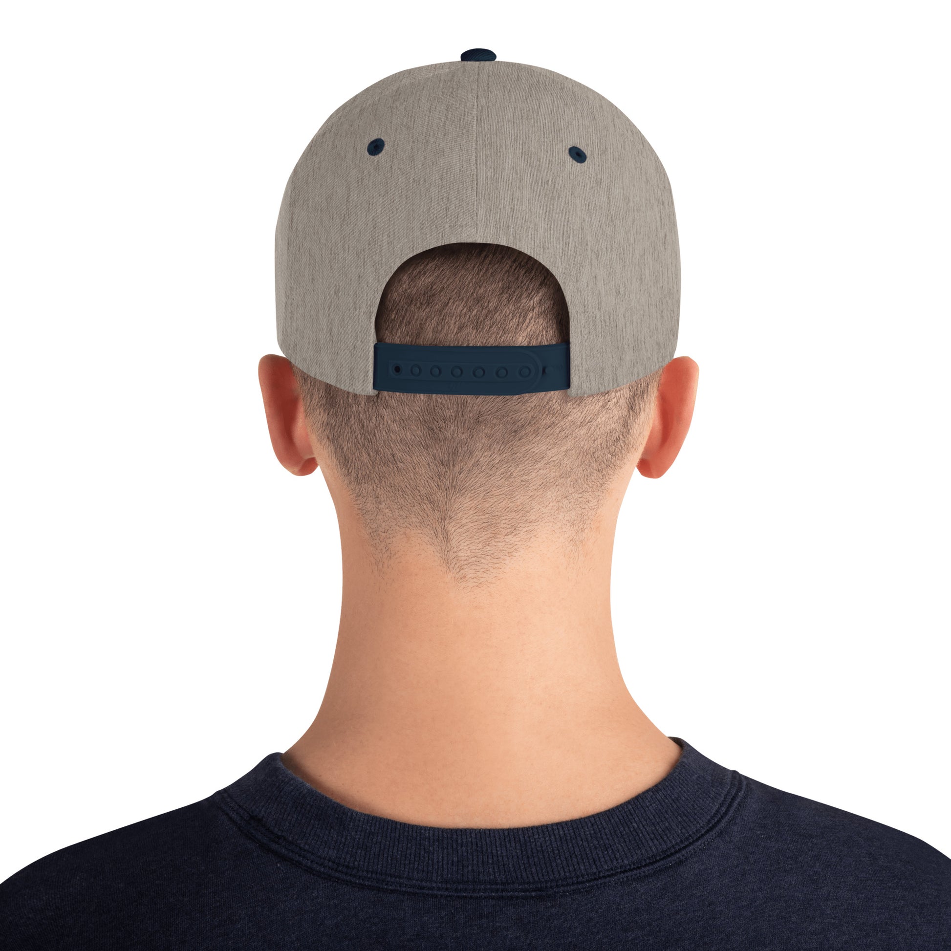Back view of person wearing heather grey and navy snapback cap with adjustable strap