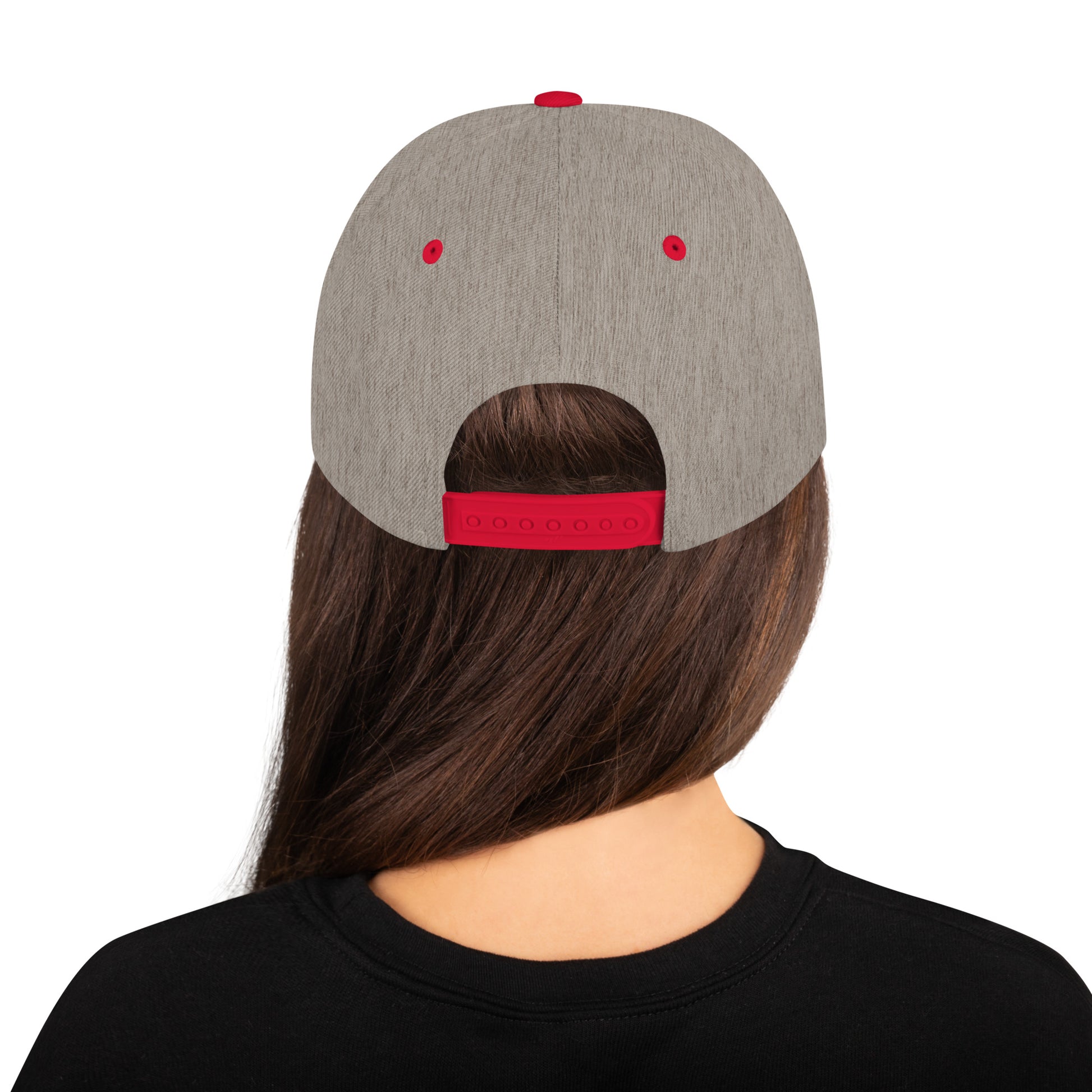 Back view of person with long brown hair wearing a heather grey snapback cap with red adjustable strap and eyelets