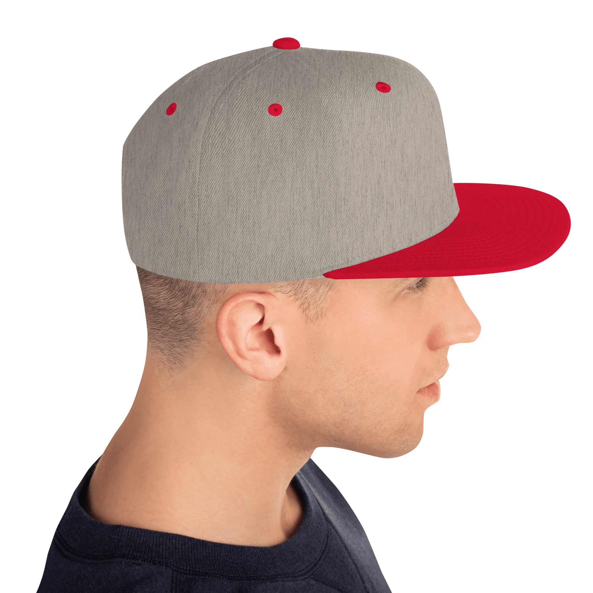 Right side profile of man wearing classic snapback cap in heather grey with red brim and eyelets