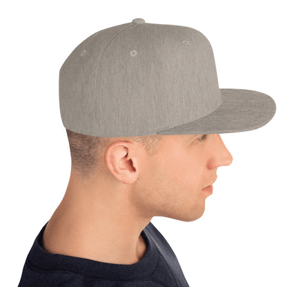 Side view of man wearing classic heather grey snapback hat with flat brim on white background