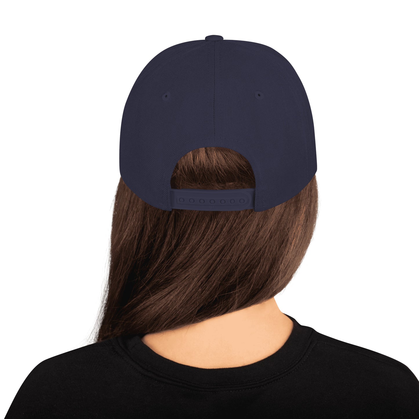 Back view of person wearing navy blue classic snapback hat with adjustable strap and long brown hair