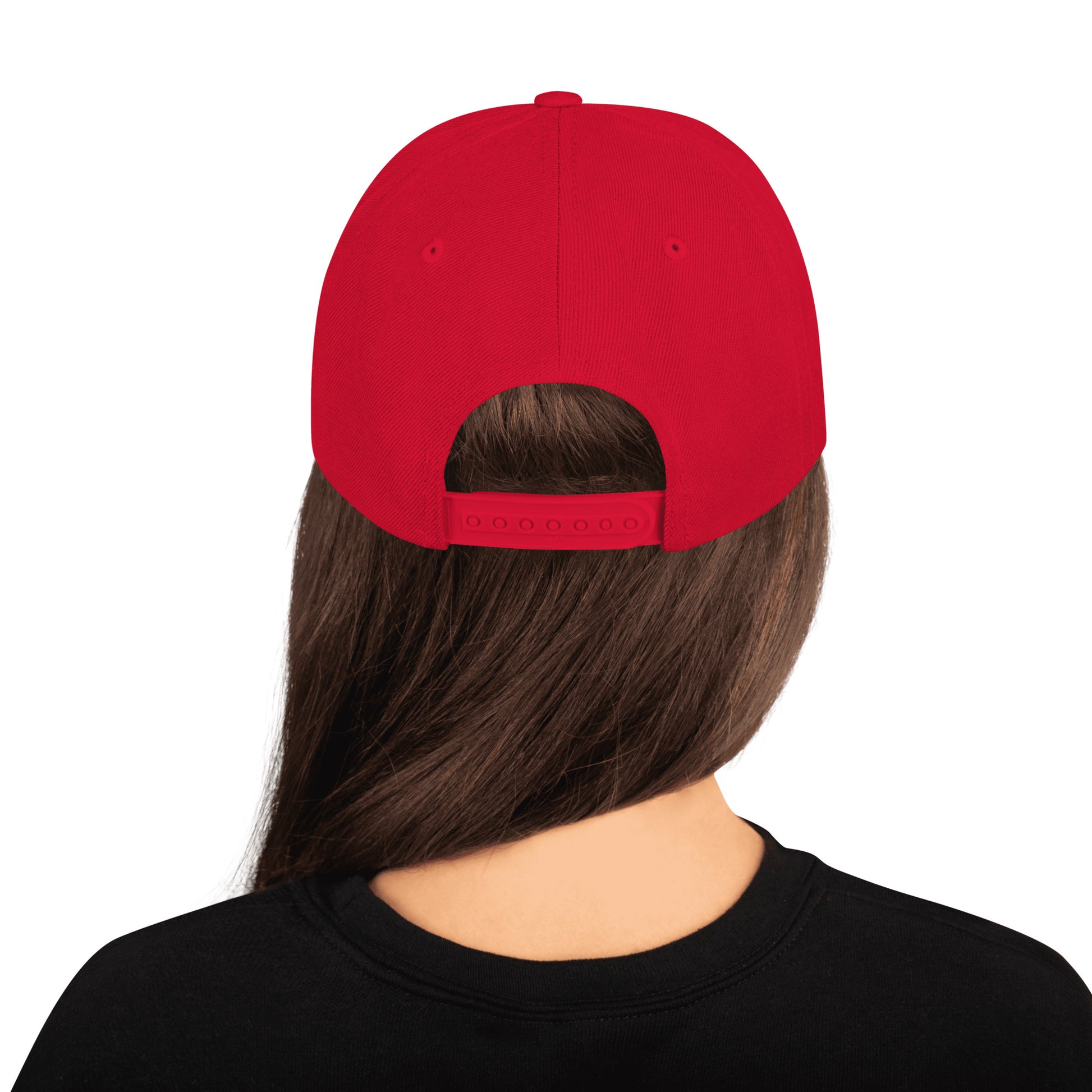 Back view of person wearing a classic red adjustable snapback cap with long brown hair