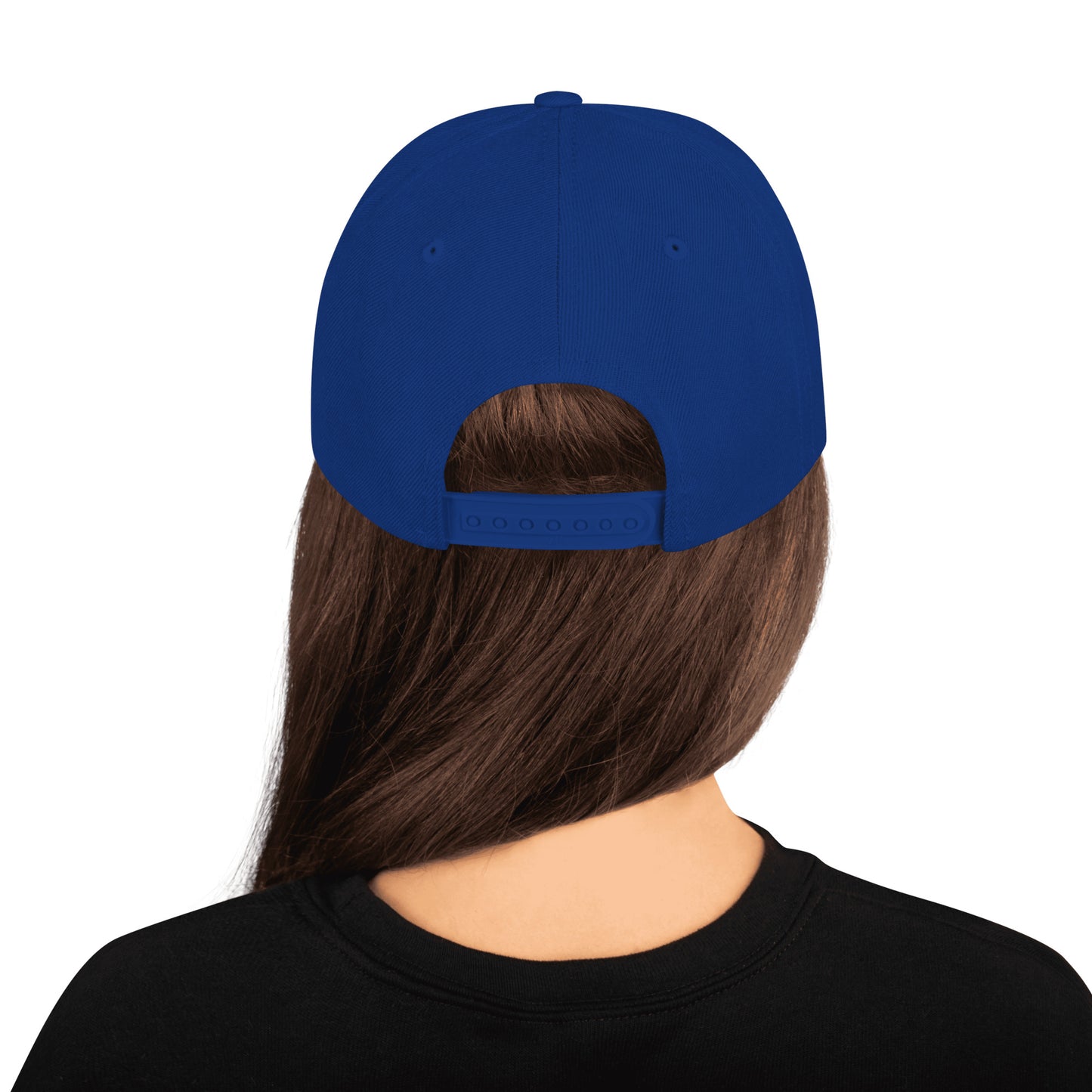 Back view of person wearing royal blue classic snapback cap with adjustable strap and long brown hair