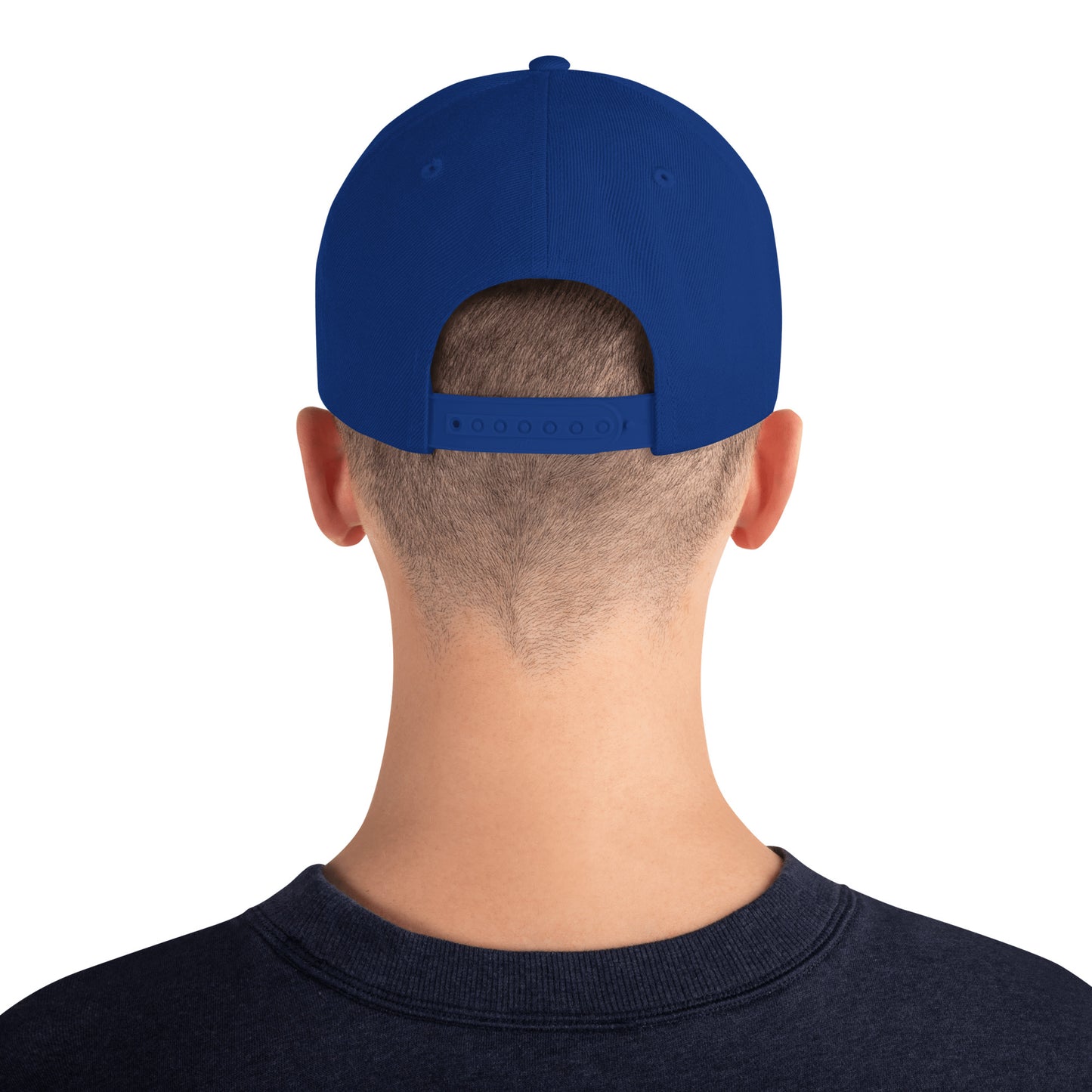 Back view of man wearing royal blue classic snapback hat with adjustable strap and navy sweatshirt