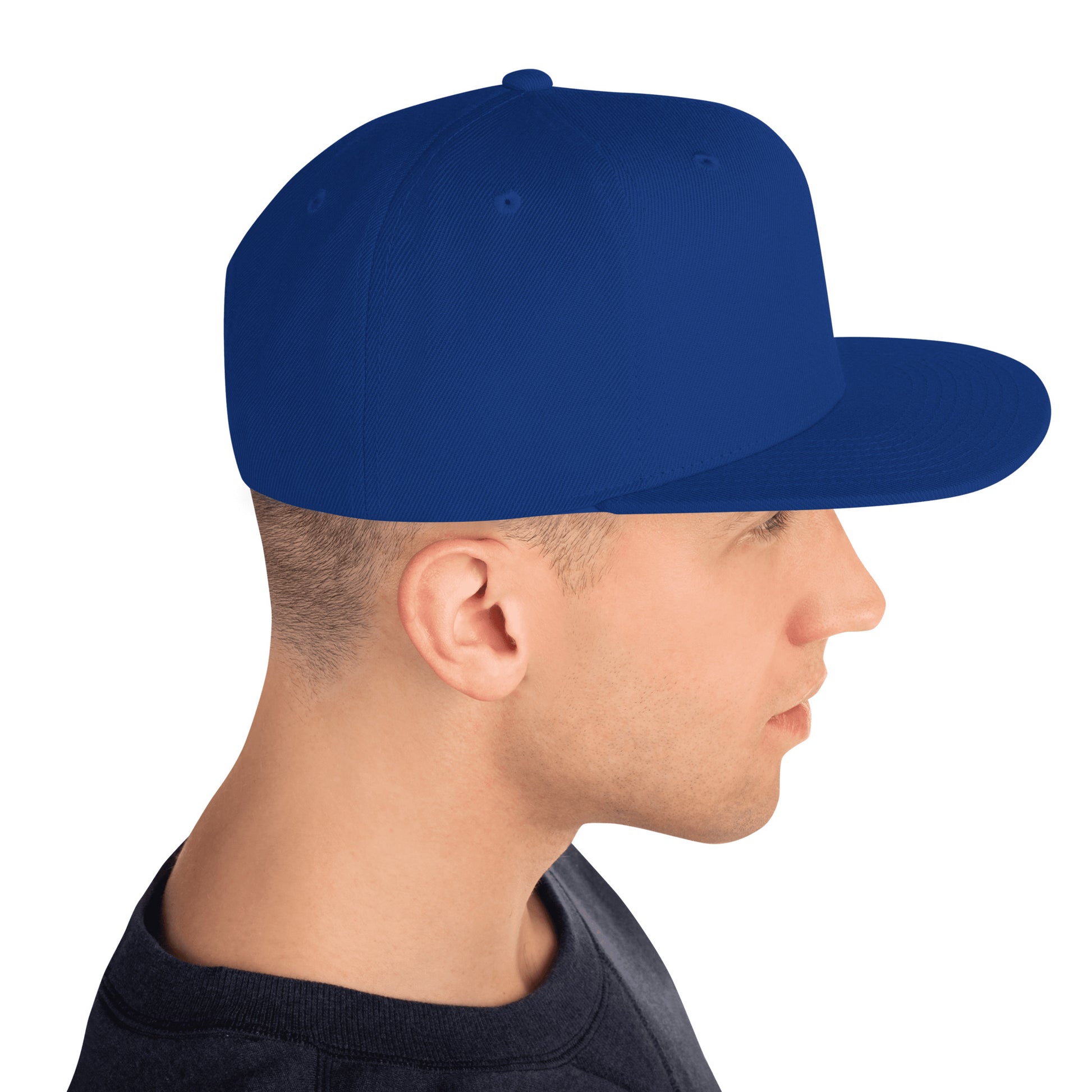 Side profile of man wearing royal blue classic snapback hat with flat brim