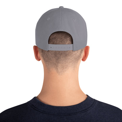 Rear view of a man wearing a silver snapback hat with adjustable strap and navy blue shirt