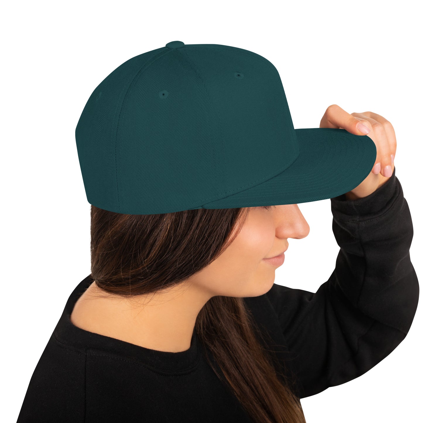 Side view of woman wearing spruce green classic snapback hat with flat bill and black sweater
