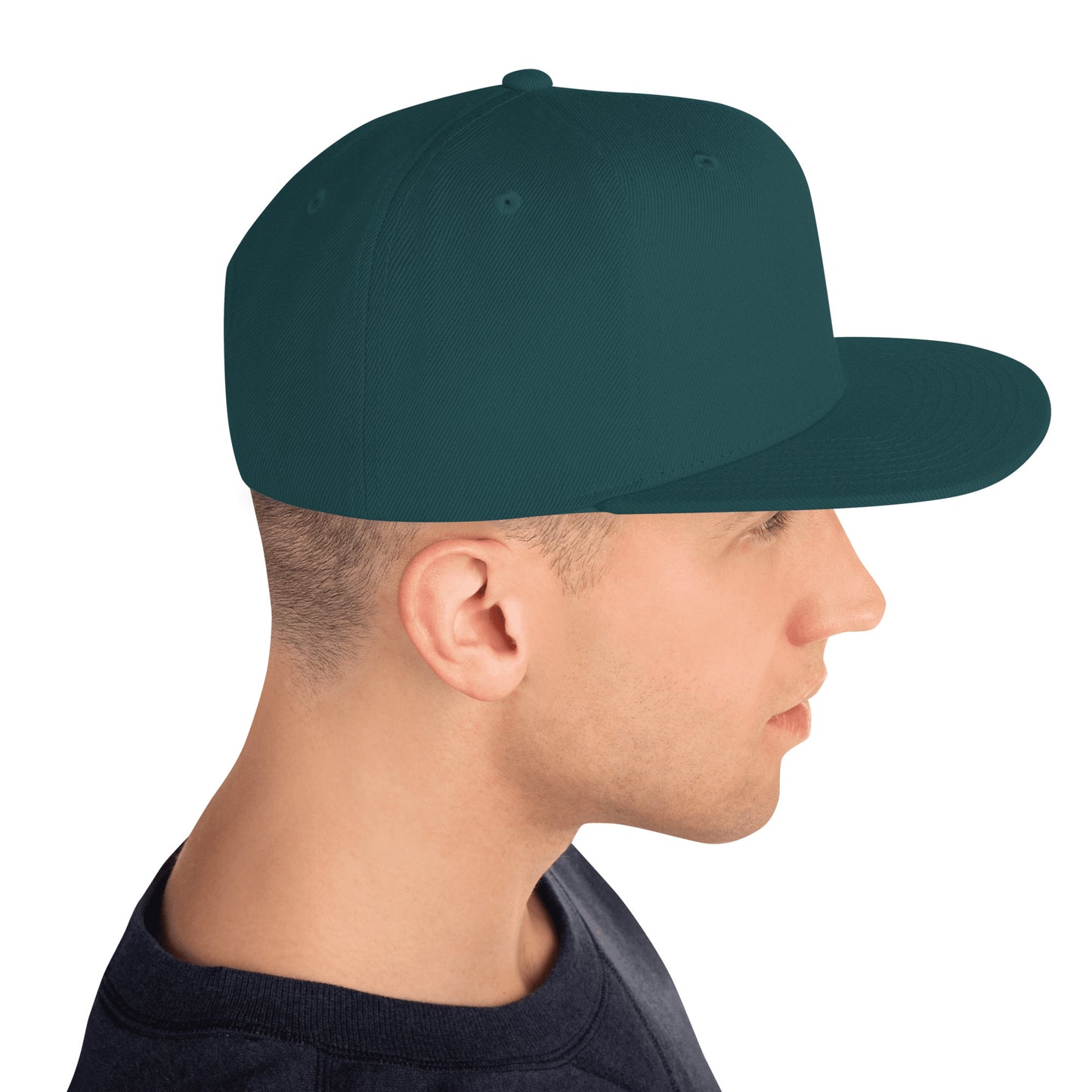 Side profile of man wearing solid spruce green classic snapback hat with flat brim