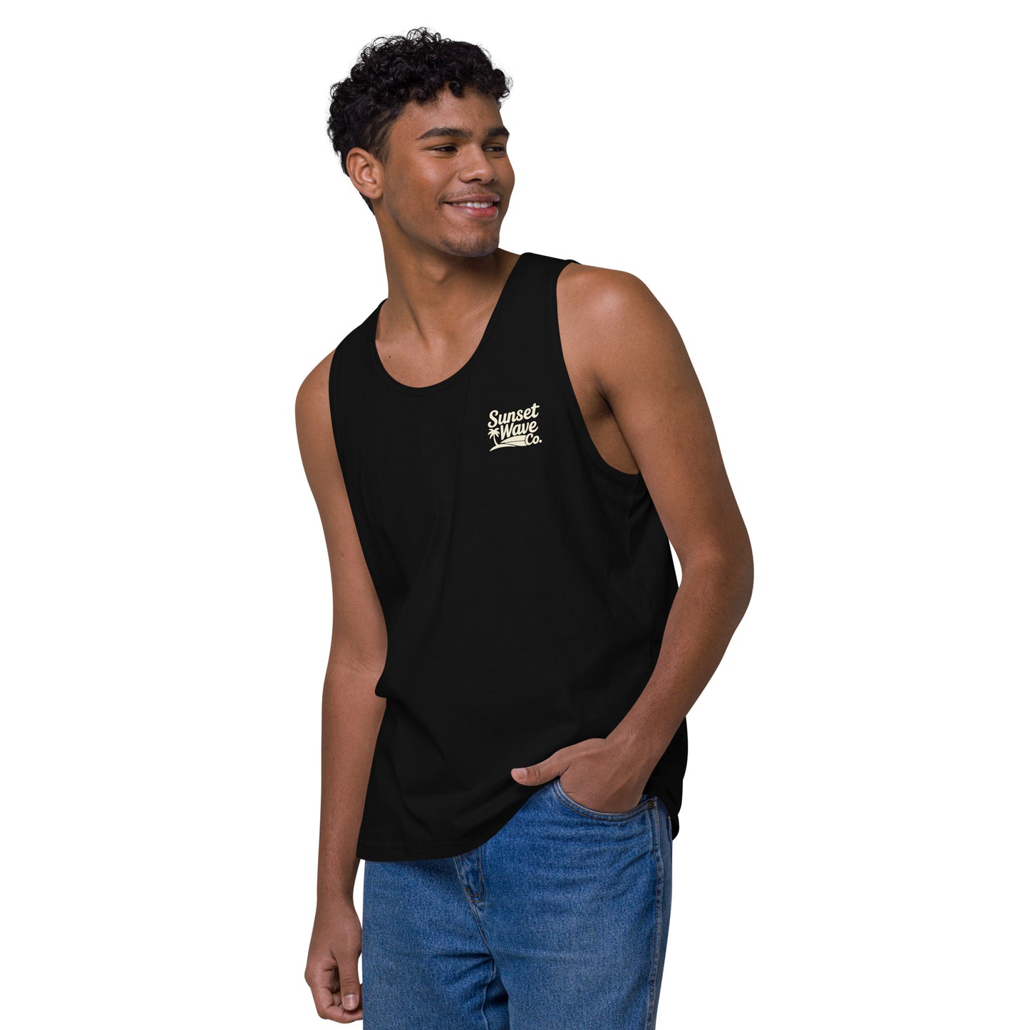 Smiling man wearing black Sunset Wave Co. premium tank top and blue jeans on white background