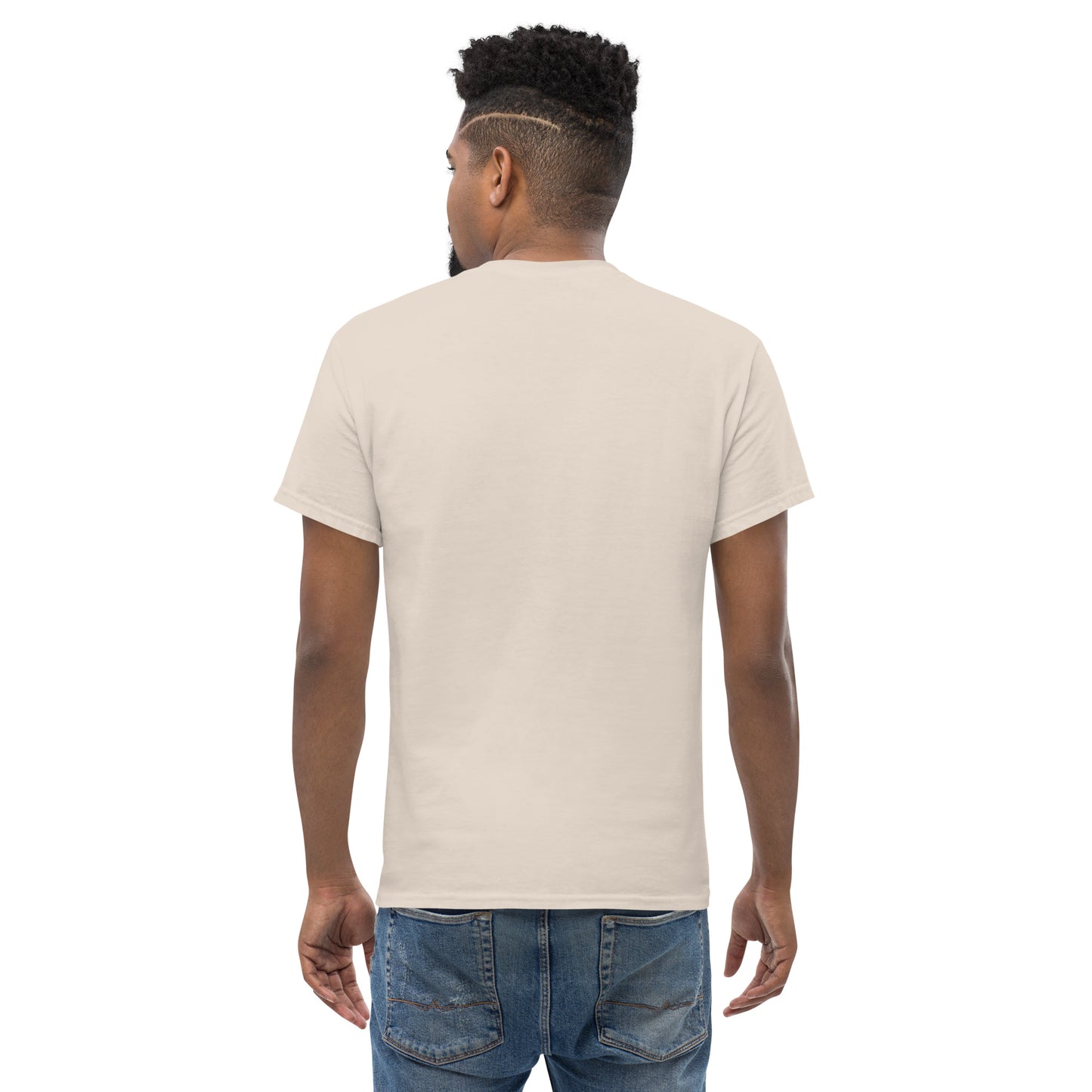Man wearing natural color unisex classic t-shirt, viewed from back, paired with blue jeans on white background