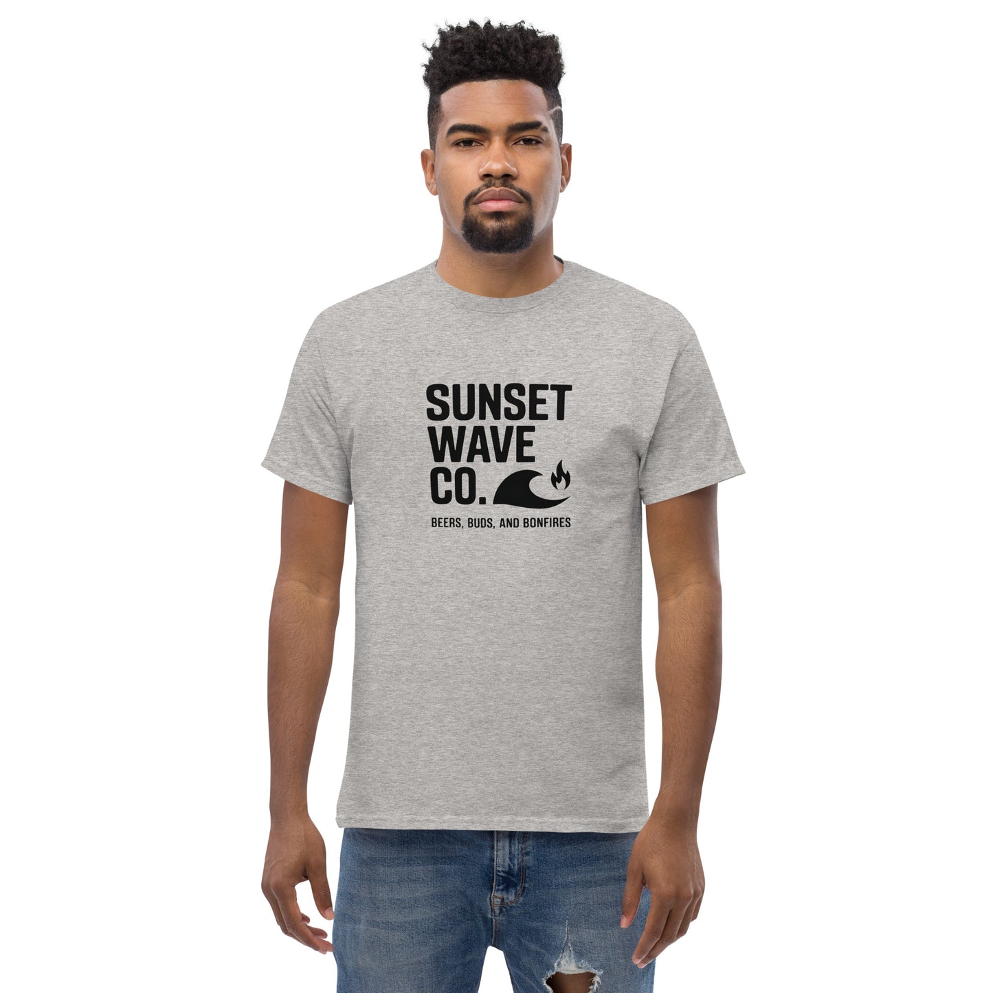 Man wearing sport grey Sunset Wave Co. t-shirt with wave and bonfire graphic, casual outfit