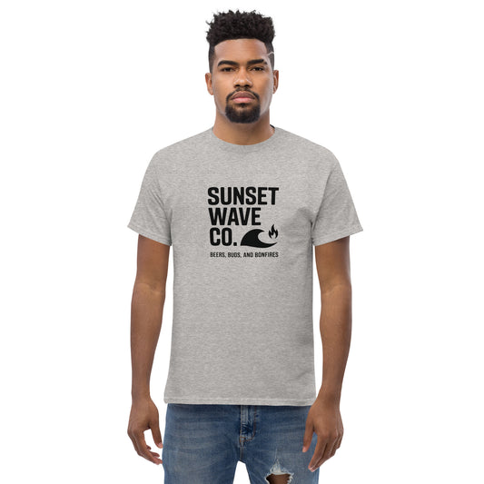 Man wearing sport grey Sunset Wave Co. t-shirt with wave and bonfire graphic, casual outfit