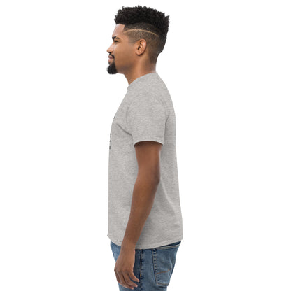 Side view of man wearing unisex classic sport grey t-shirt and blue jeans on white background