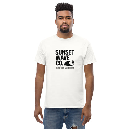 Man wearing white classic tee with black Sunset Wave Co. logo and bonfire graphic