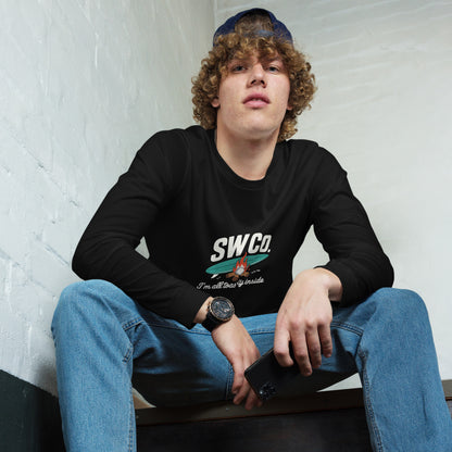 Young man wearing a black SWCo. long sleeve tee with campfire design, blue jeans, and a backwards cap