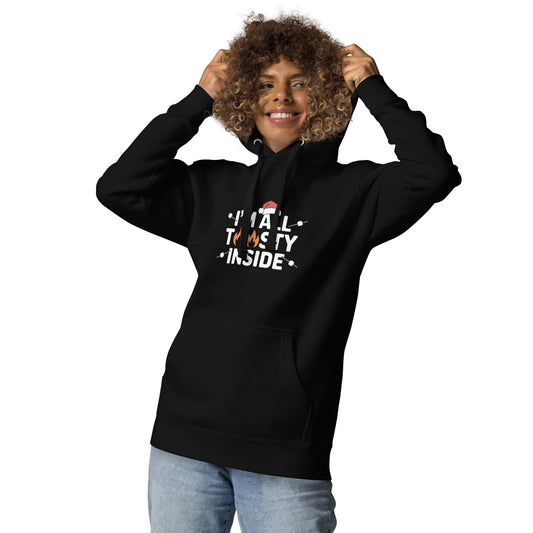 Smiling person in black unisex premium hoodie with festive marshmallow print on front