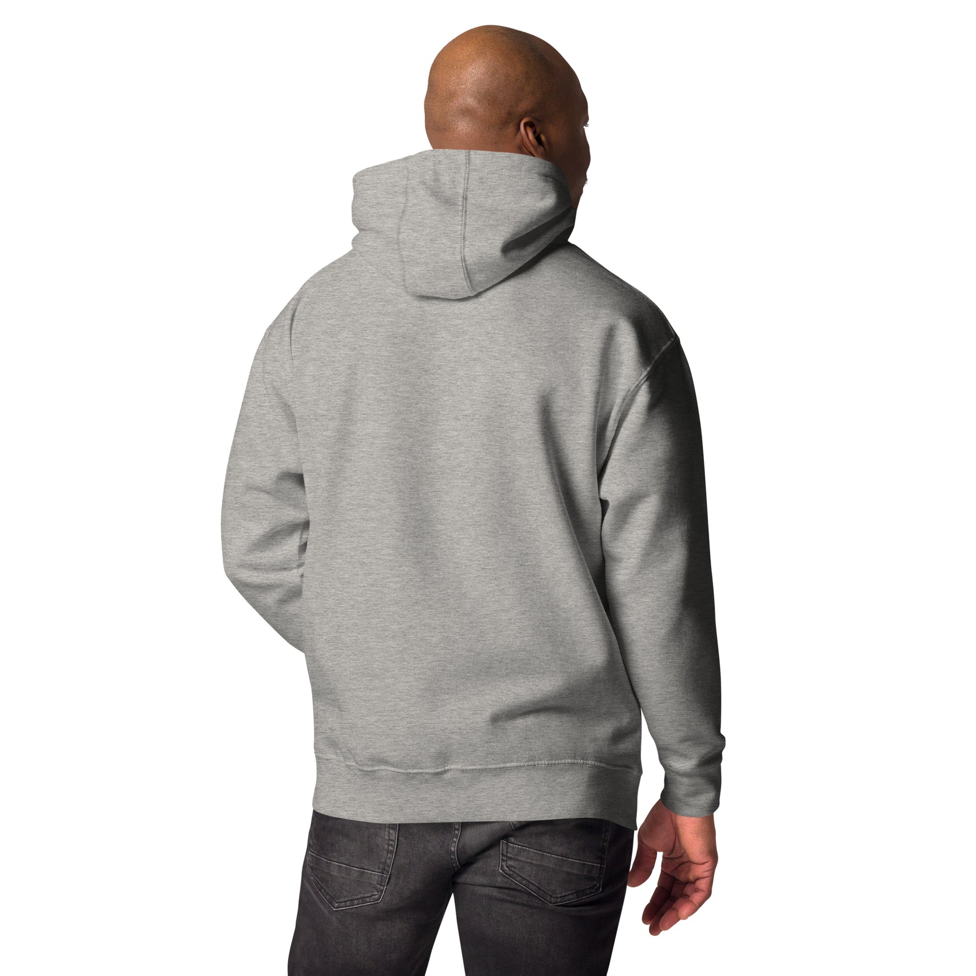 Back view of man wearing light grey unisex premium hoodie with hood up, paired with dark jeans