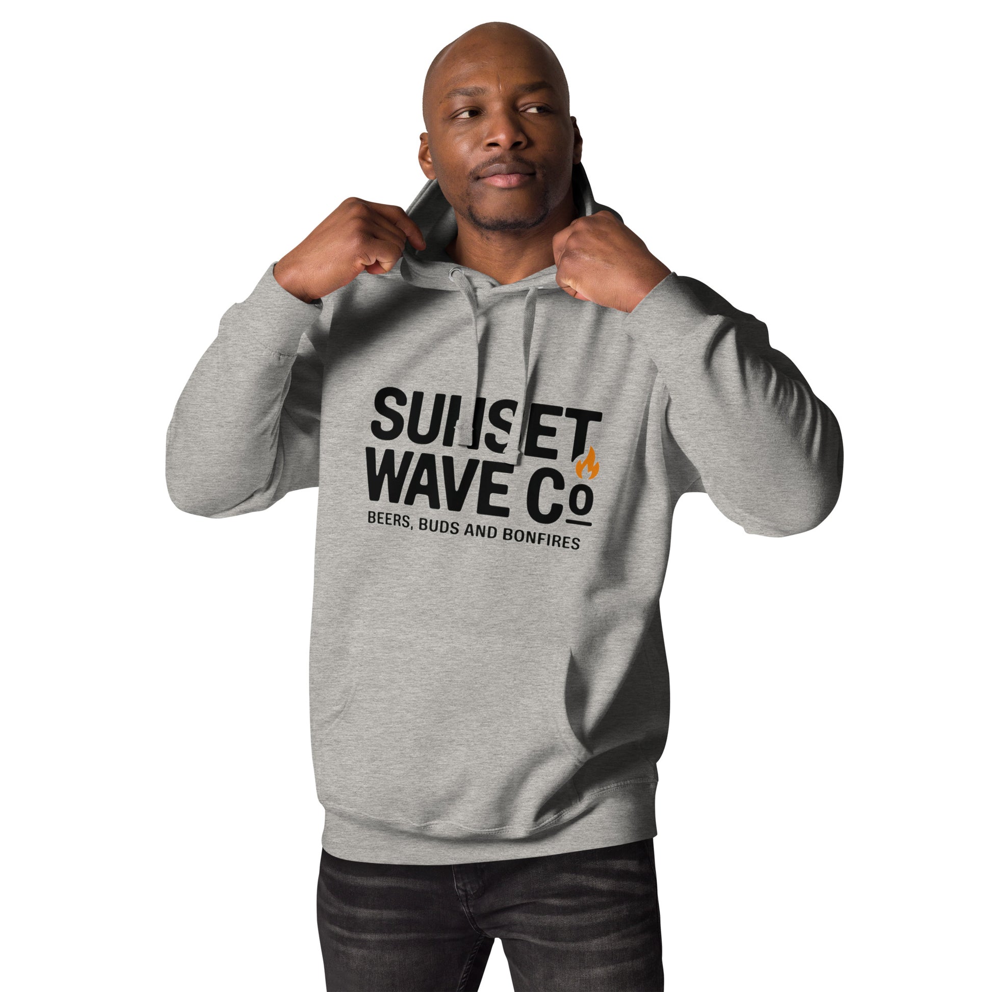 Man wearing unisex premium grey hoodie with Sunset Wave Co text and flame graphic