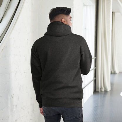 Man wearing charcoal heather unisex premium hoodie shown from back in bright modern room