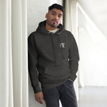 Man wearing charcoal heather unisex premium hoodie with white Sunset Wave Coast logo in bright indoor setting