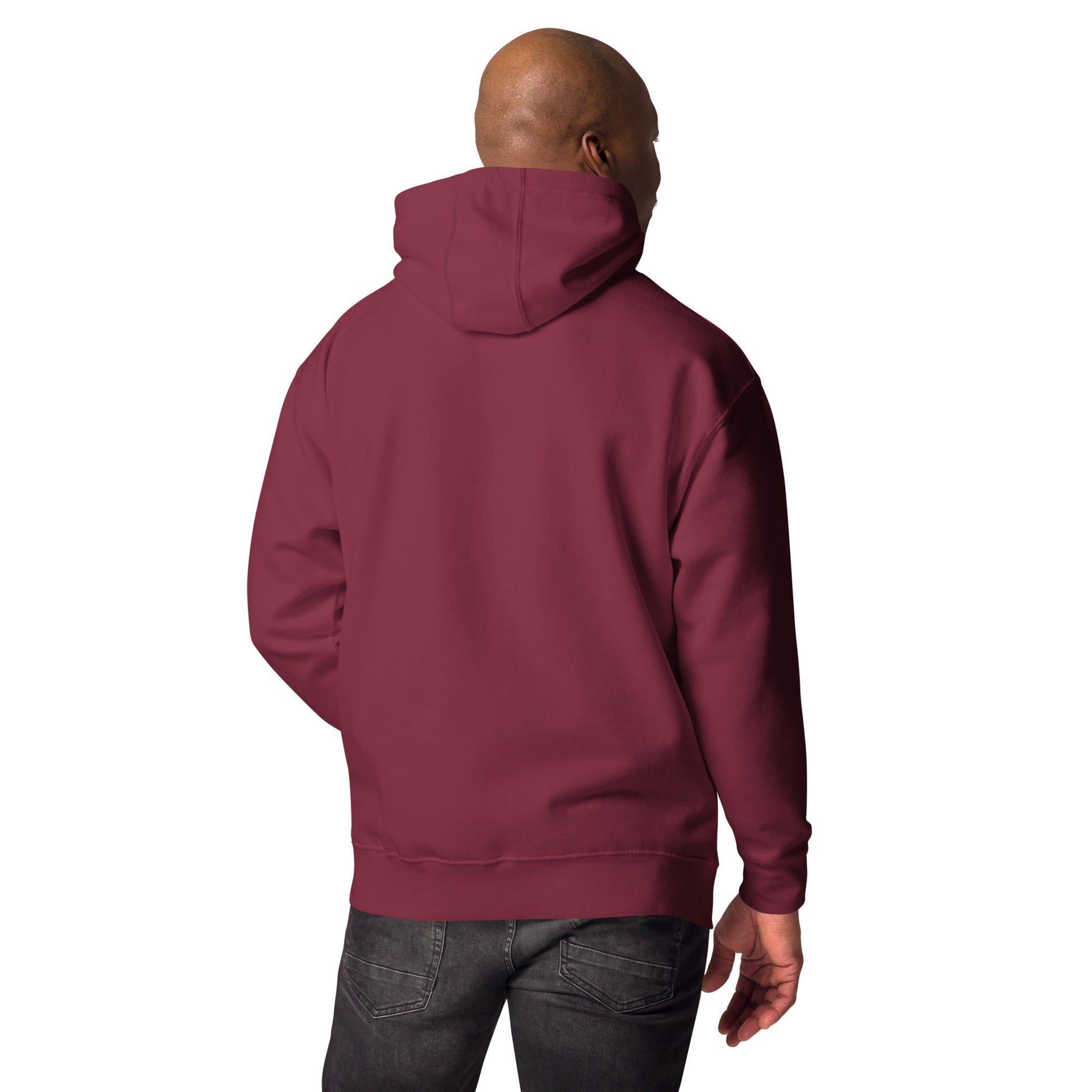 Unisex premium maroon hoodie with hood worn by man shown from back, paired with dark jeans