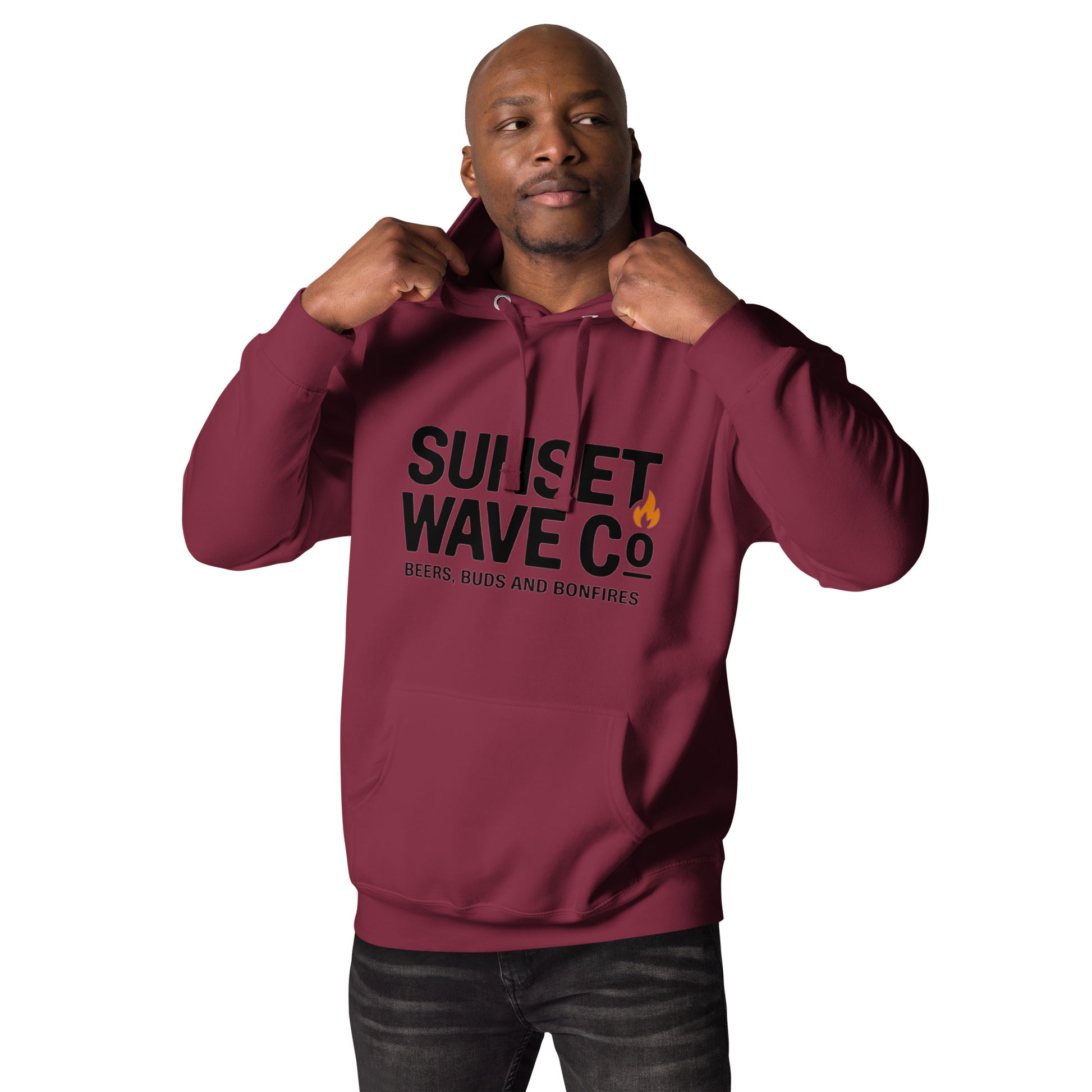 Man wearing maroon unisex premium hoodie with black "Sunset Wave Co" text and flame icon