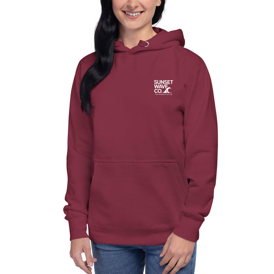 Maroon unisex premium hoodie with white Sunset Wave Co. logo worn by smiling person