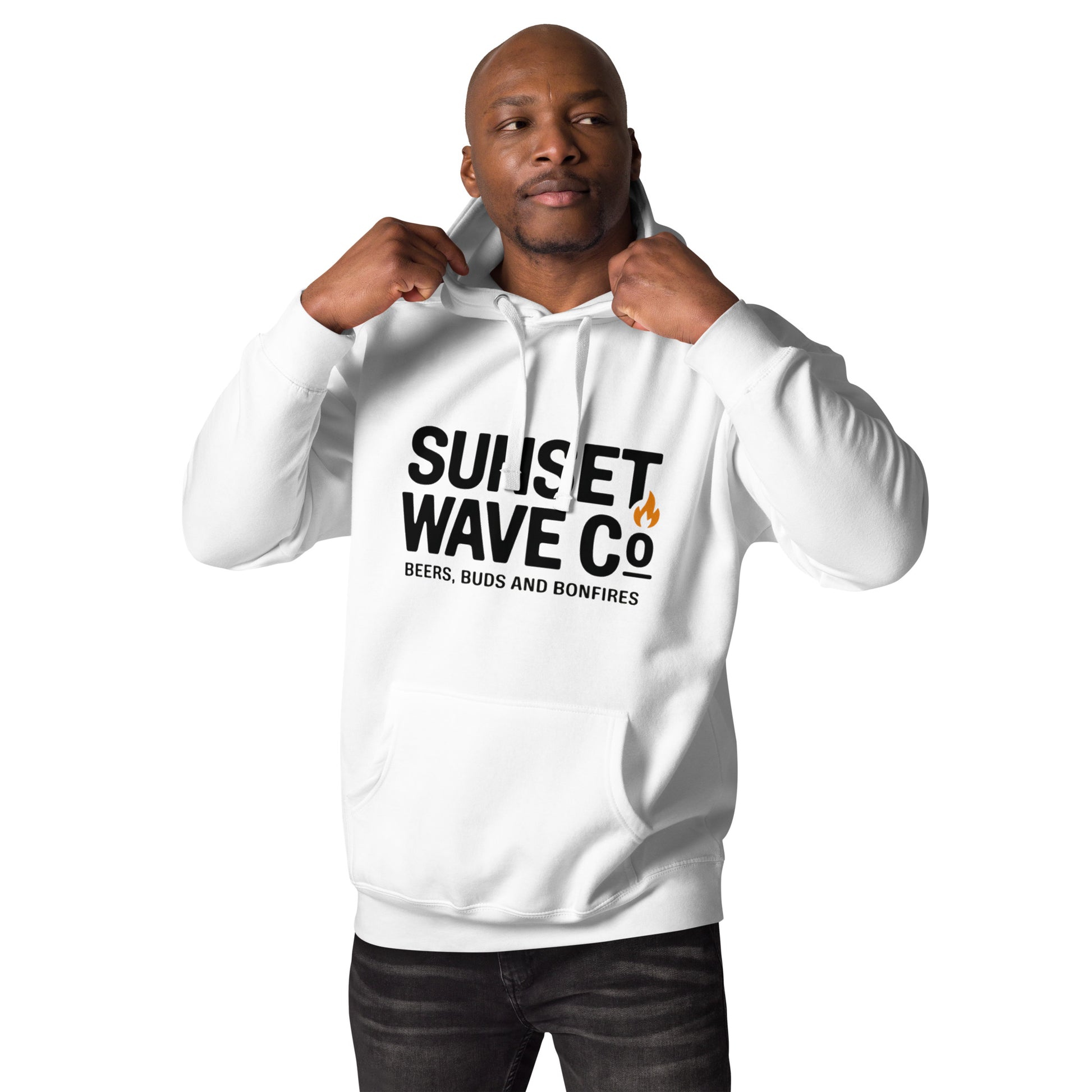 Man wearing white unisex premium hoodie with Sunset Wave Co graphic and flame icon