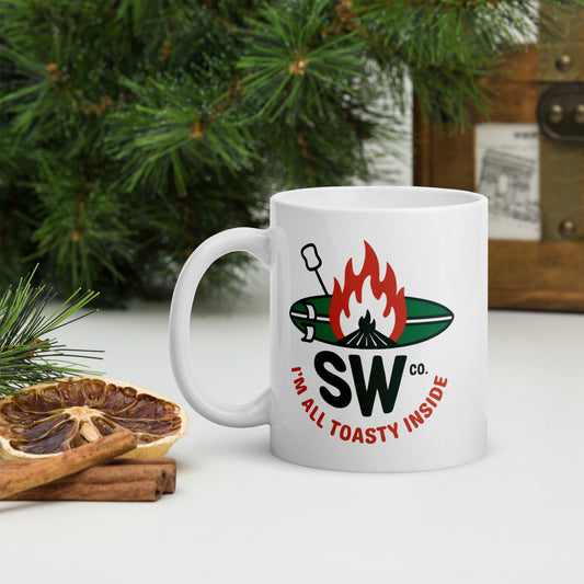 White glossy 11 oz mug with campfire and marshmallow design reading 'SW Co. I'm all toasty inside'
