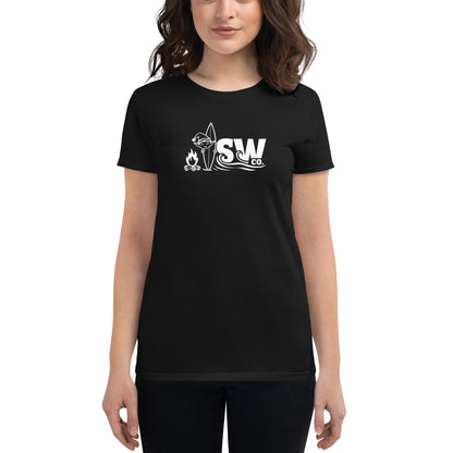 Woman wearing black fitted t-shirt with white SW Co. logo featuring campfire, surfboard, and waves