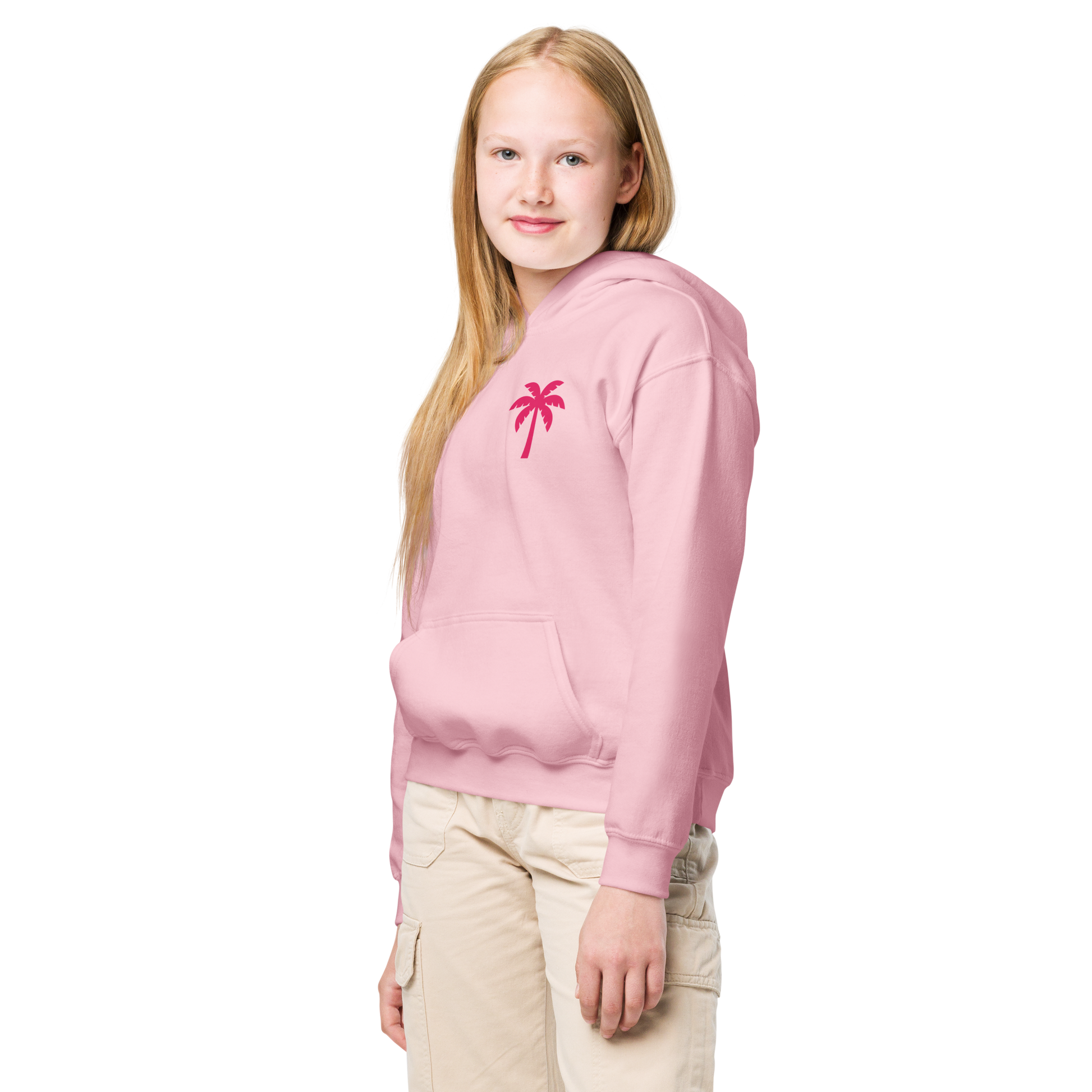 Teen girl wearing light pink hoodie with red palm tree print and beige cargo pants